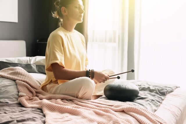 Mental health mindfullness wellbeing and balance concept. Sounds therapy. Women health. Tank drum