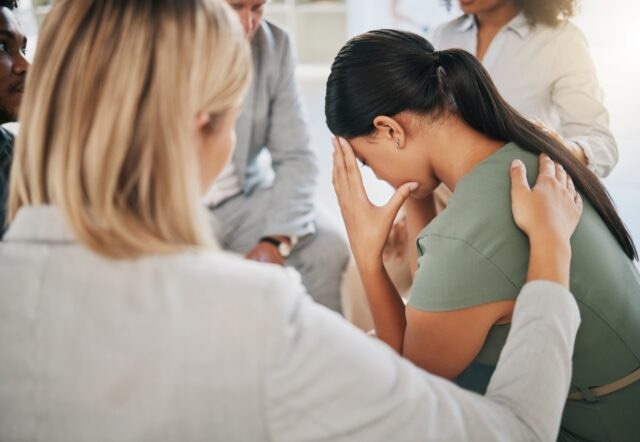 woman at community support group for mental health, counseling or help