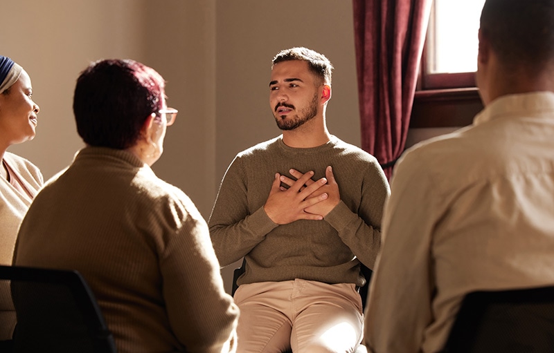 People participate in group therapy for trauma.