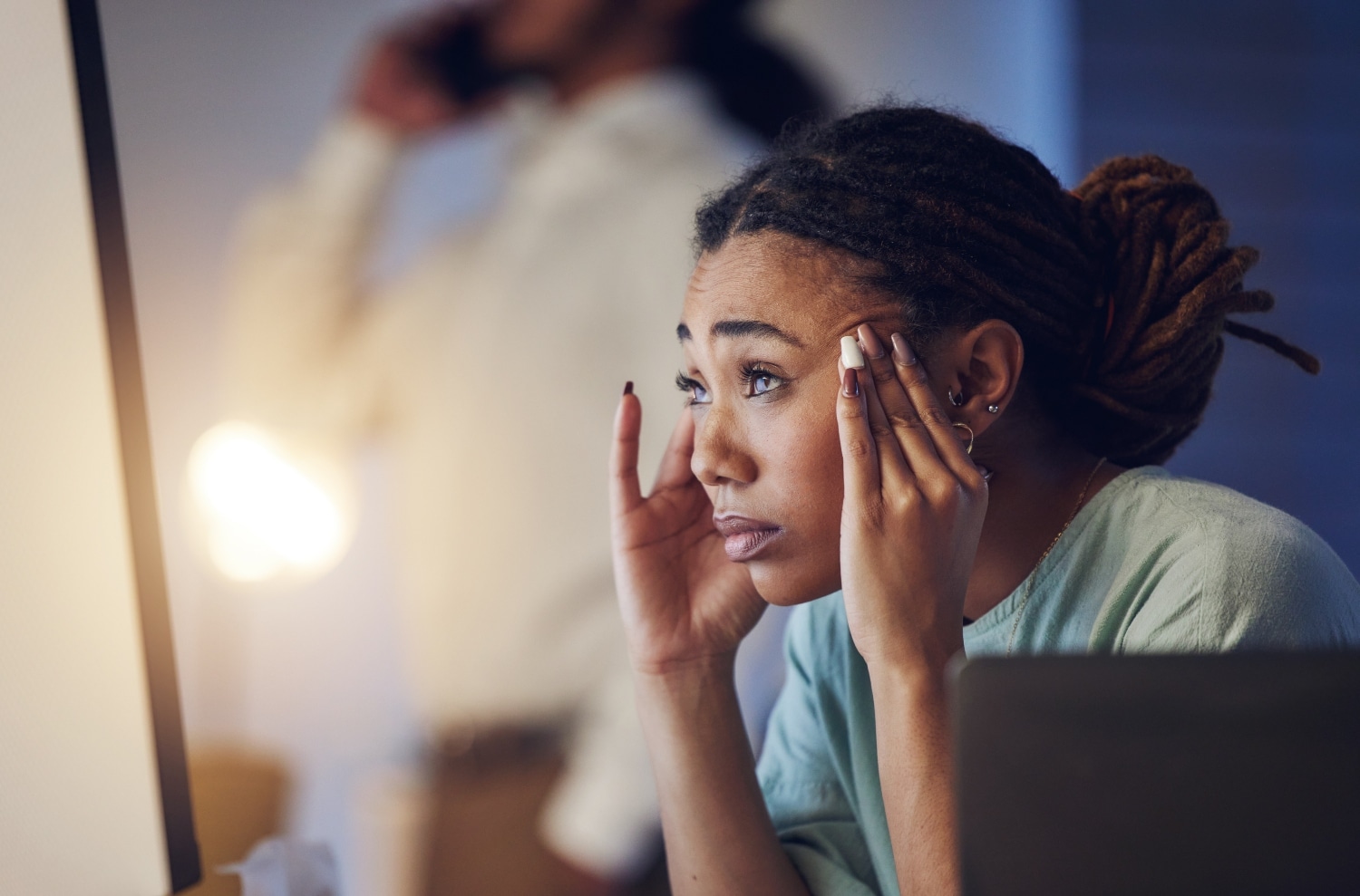 woman employee looking ahead worrying stressed at work