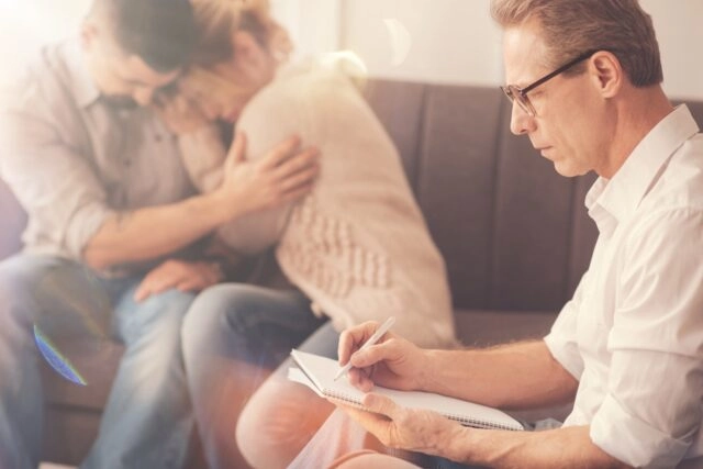 crying couple in therapy