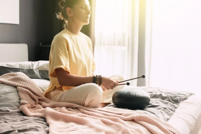 Mental health mindfullness wellbeing and balance concept. Sounds therapy. Women health. Tank drum Mental health mindfullness wellbeing and balance concept. Sounds therapy. Women health. Tank drum
