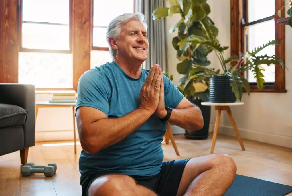 Home meditation, zen and senior man work on inner spiritual peace