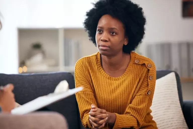 A woman participates in therapy for trauma.